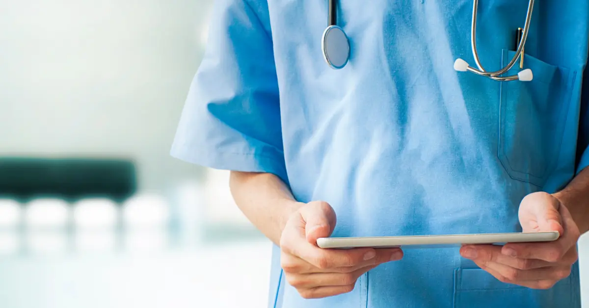doctor reading notes on clipboard